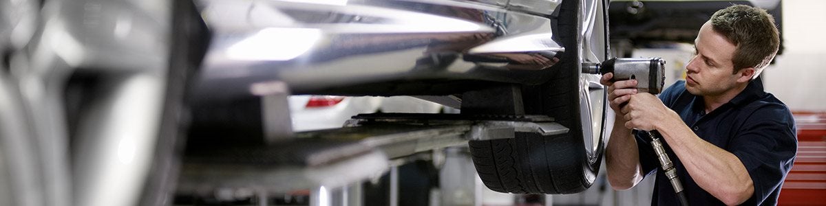 Mechanic working on vehicle